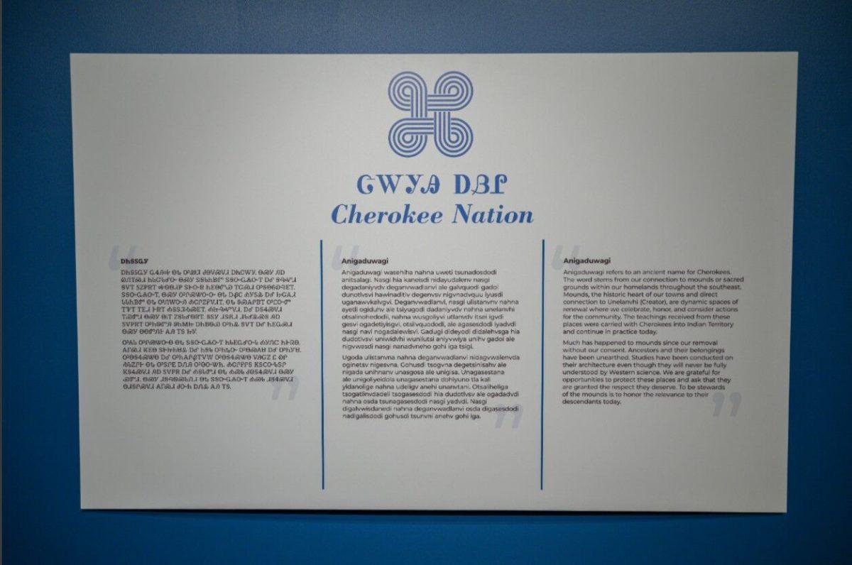 A didactic panel with a statement from the Cherokee Nation. From left to right: untranslated symbols, the untranslated letters, then translated into English.