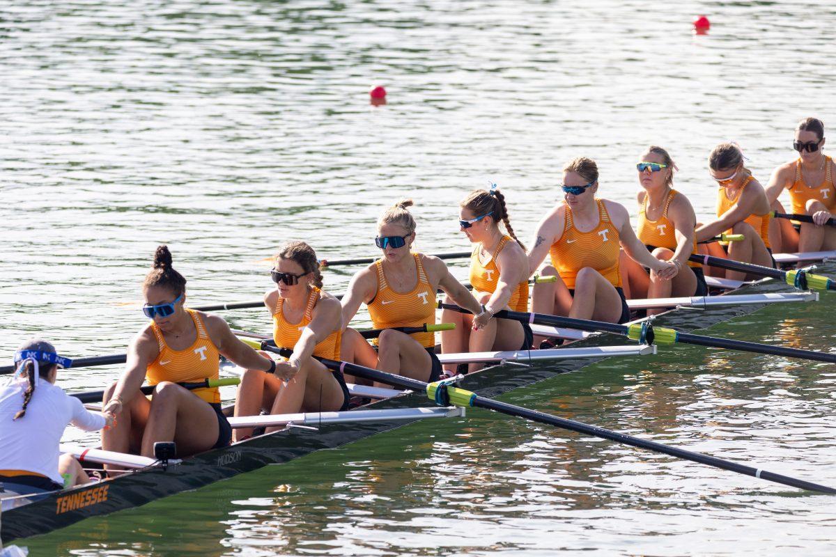 Tennessee’s 3V8 boat seen holding hands in prayer before their race at the SEC Championship on Melton Hill Lake. Sunday, May 11, 2025. 