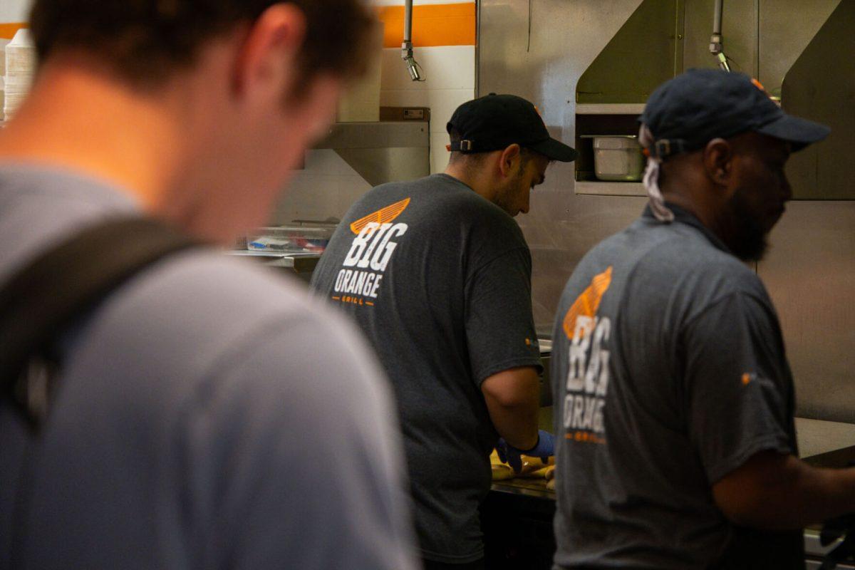 Cooks grill burgers at Big Orange Grill, located in the Student Union, Friday, Aug. 22, 2025.