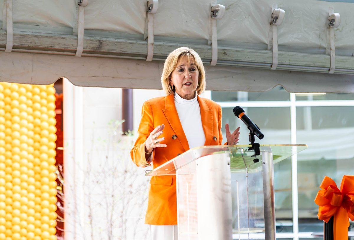 Chancellor Donde Plowman gives a speech at the Poplar Hall dedication ceremony. Monday, Aug. 18, 2025.