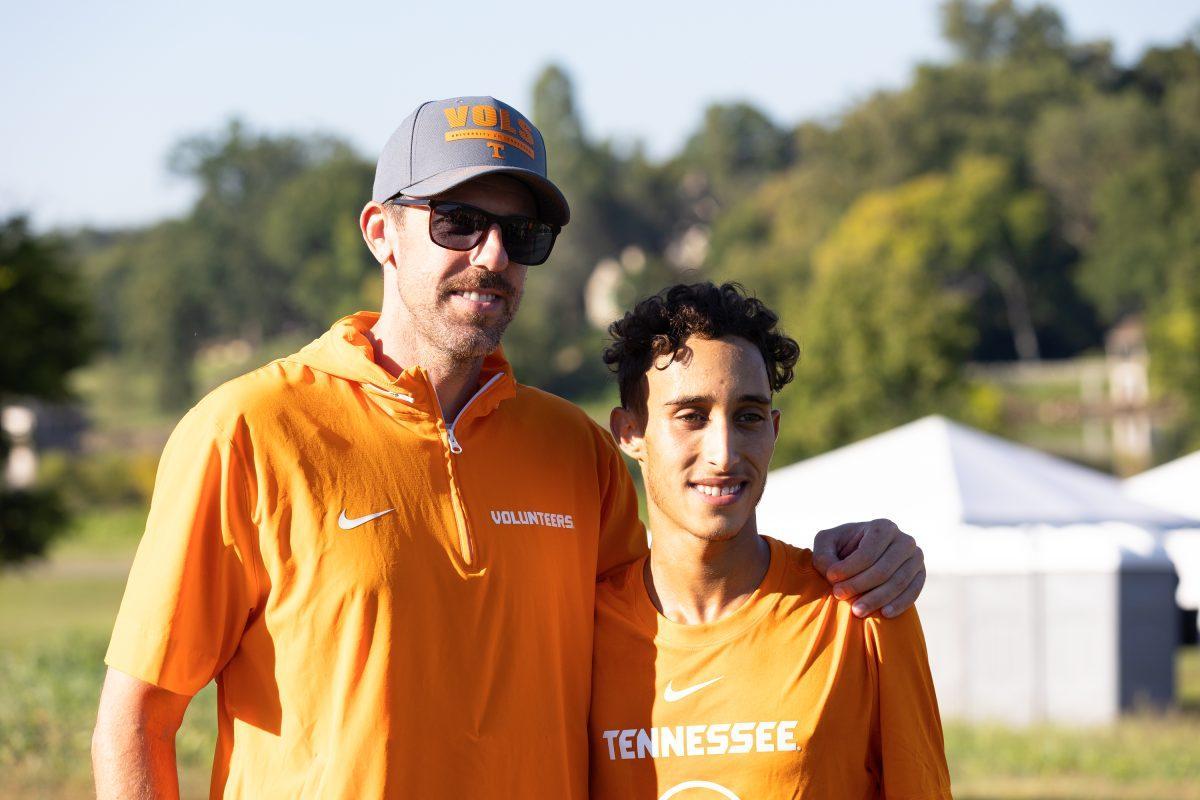 Cross Country head coach Justin Duncan poses with men's race winner Zouhair Redouane at the conclusion of the Tennessee Cross Country Invitational at Cherokee Farm. Friday, Aug. 29, 2025.
