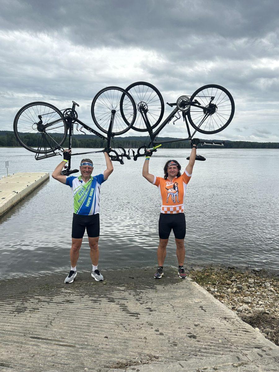 Sophomore Josh Malloy and his dad celebrate their 406-mile summer bike trek across the state of Iowa.