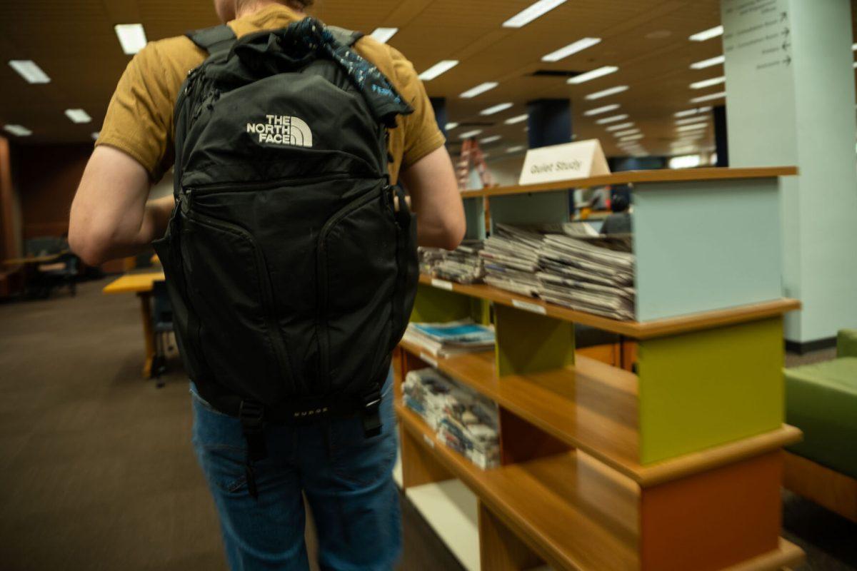 An anonymous student who says he was questioned by UTPD during the active threat hoax incident stands outside Hodges Library on Aug. 25, 2025.