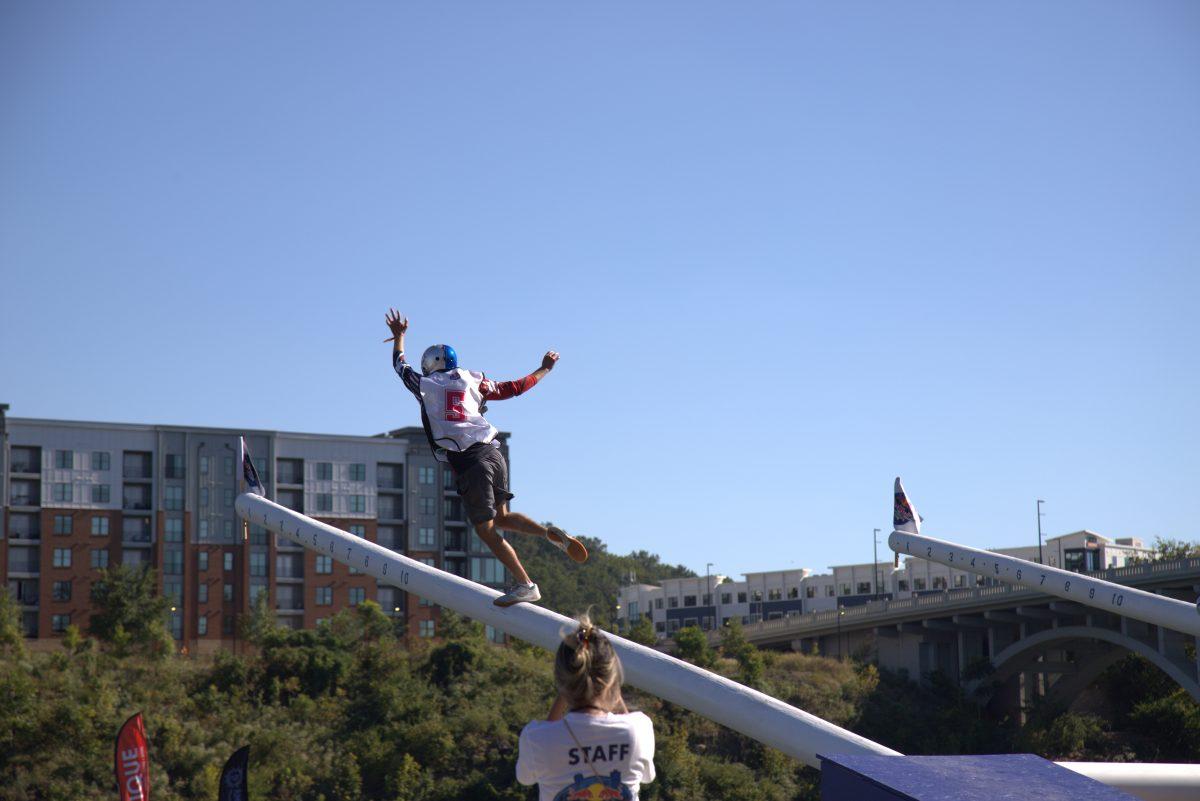 A competitor runs up the goalposts on Sept. 12, 2025.