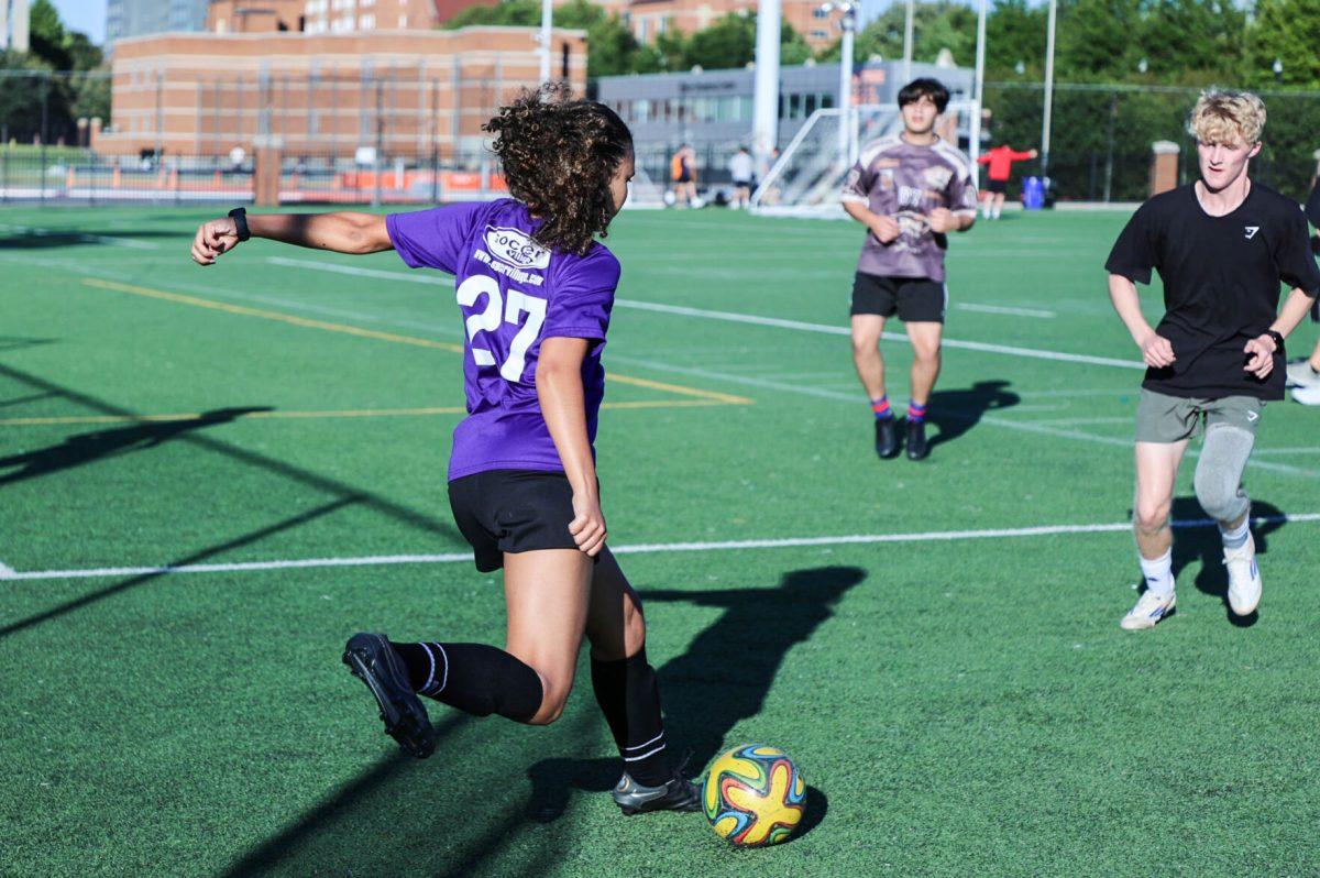 Johanna Greer prepares to kick the ball during a WLC soccer practice on the TRECs field. Friday, Sept. 12, 2025.