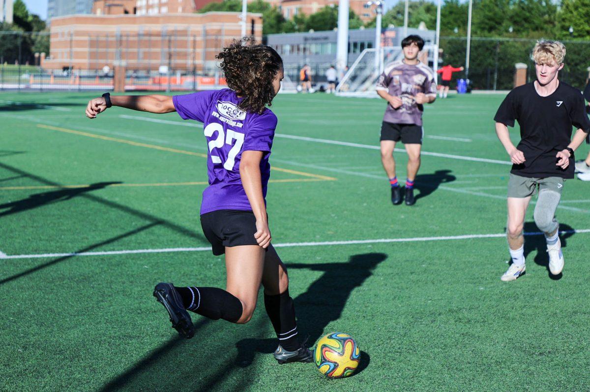 Johanna Greer prepares to kick the ball during a WLC soccer practice on the TRECs field. Friday, Sept. 12, 2025.