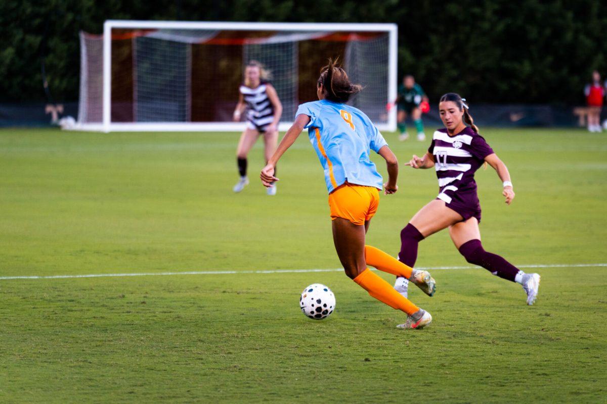 Anaiyah Robinson (9) kicks the ball against a Texas A&amp;M defender, Sept. 26, 2025
 