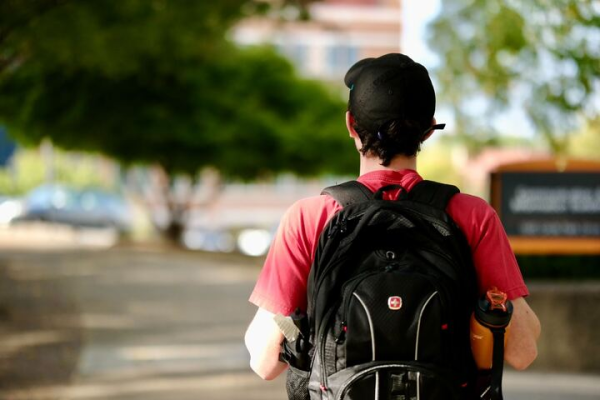 College student walking to class on campus.