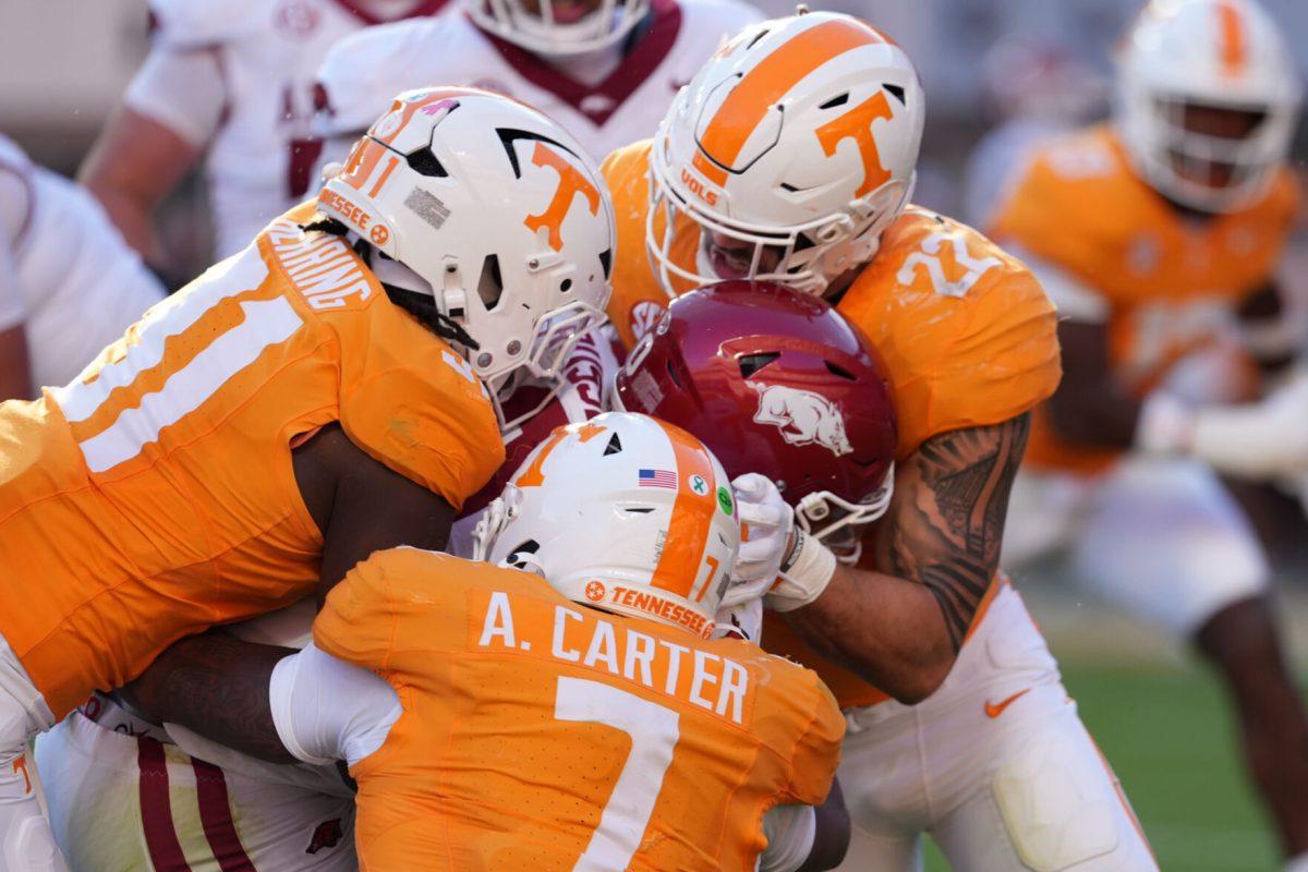 Arion Carter (7), Caleb Herring (31), and Jeremiah Telander (22) makes a tackle during a game against Arkansas at Neyland Stadium, Saturday, Oct.11, 2025
 