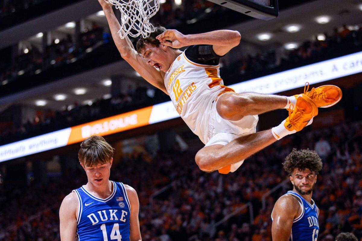 Cade Phillips (12) dunks over the Duke defense during an exhibition game at Food City Center, Sunday Oct. 26, 2025.