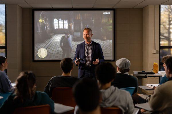Tore Olsson, Associate Professor of History and Director of Graduate Studies, uses the video game Red Dead Redemption to teach his class “Red Dead History: Exploring America’s Violent Past Through the Hit Video Games” inside a Humanities and Social Sciences building classroom on March 29, 2023. Photo by Steven Bridges/Steven Bridges/University of Tennessee.