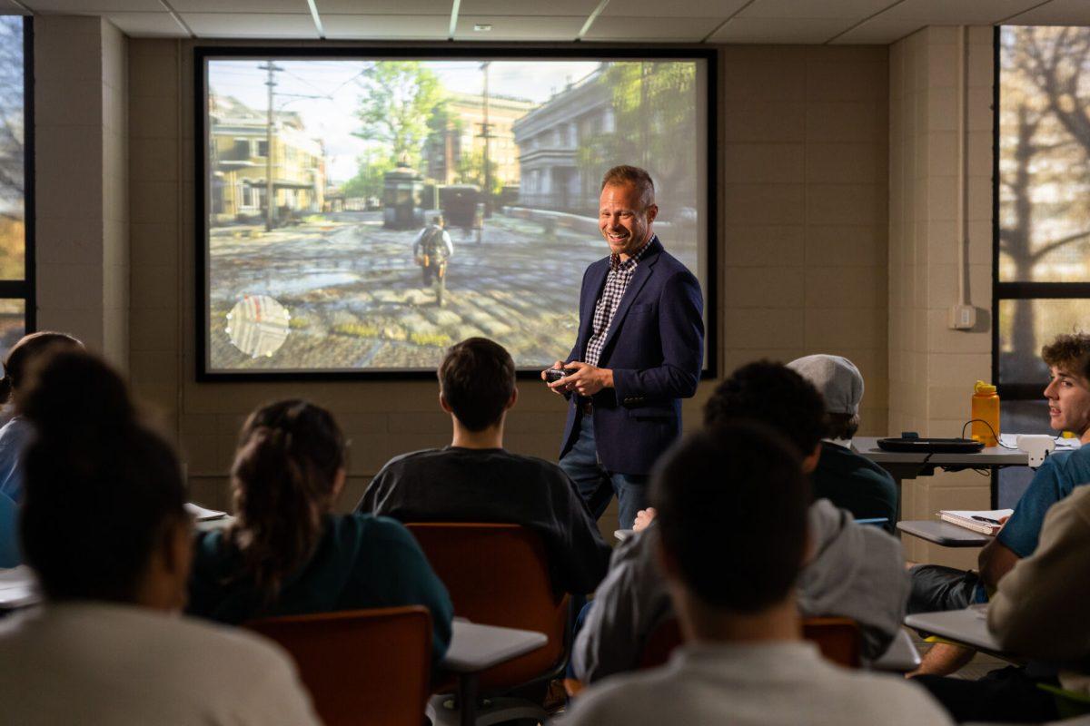 Tore Olsson, Associate Professor of History and Director of Graduate Studies, uses the video game Red Dead Redemption to teach his class “Red Dead History: Exploring America’s Violent Past Through the Hit Video Games” inside a Humanities and Social Sciences building classroom on March 29, 2023. Photo by Steven Bridges/Steven Bridges/University of Tennessee.