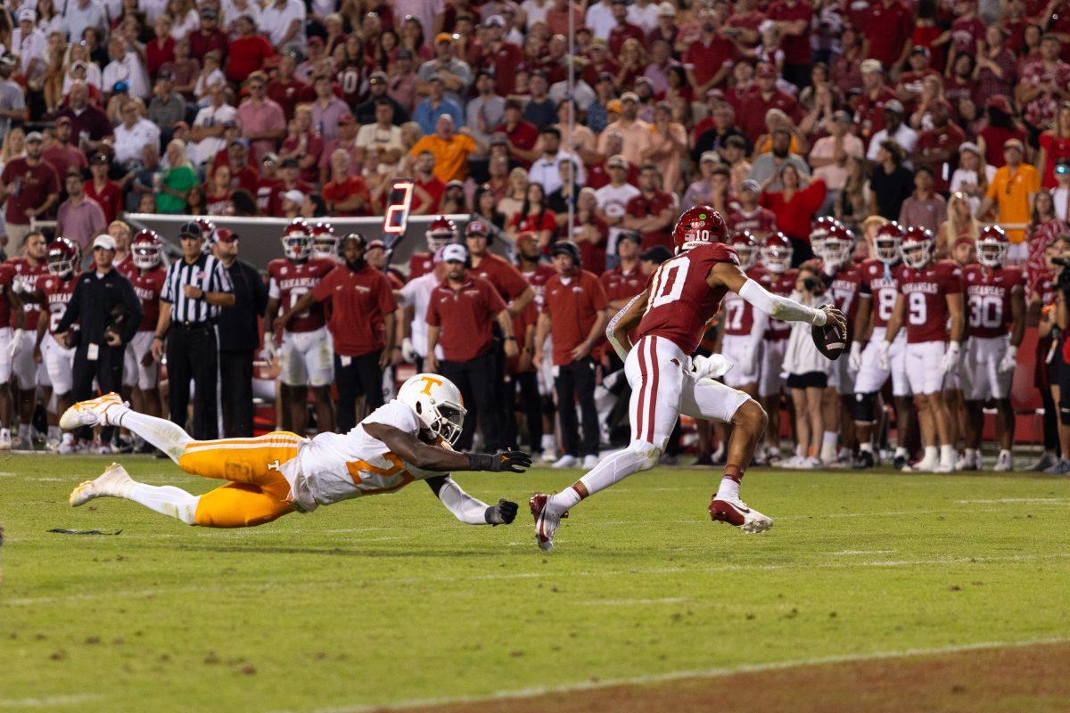 James Pearce Jr. (27) dives after the Arkansas quarterback during a game against Arkansas at Donald W. Reynolds Razorback Stadium. Saturday, Oct. 5, 2024. 