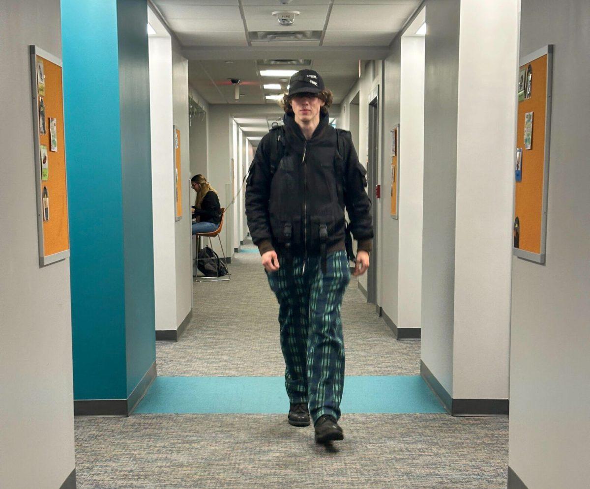UT student, Bennett Parker, walking back to his dorm after he spent the weekend at home. Thursday, Oct. 23, 2025.