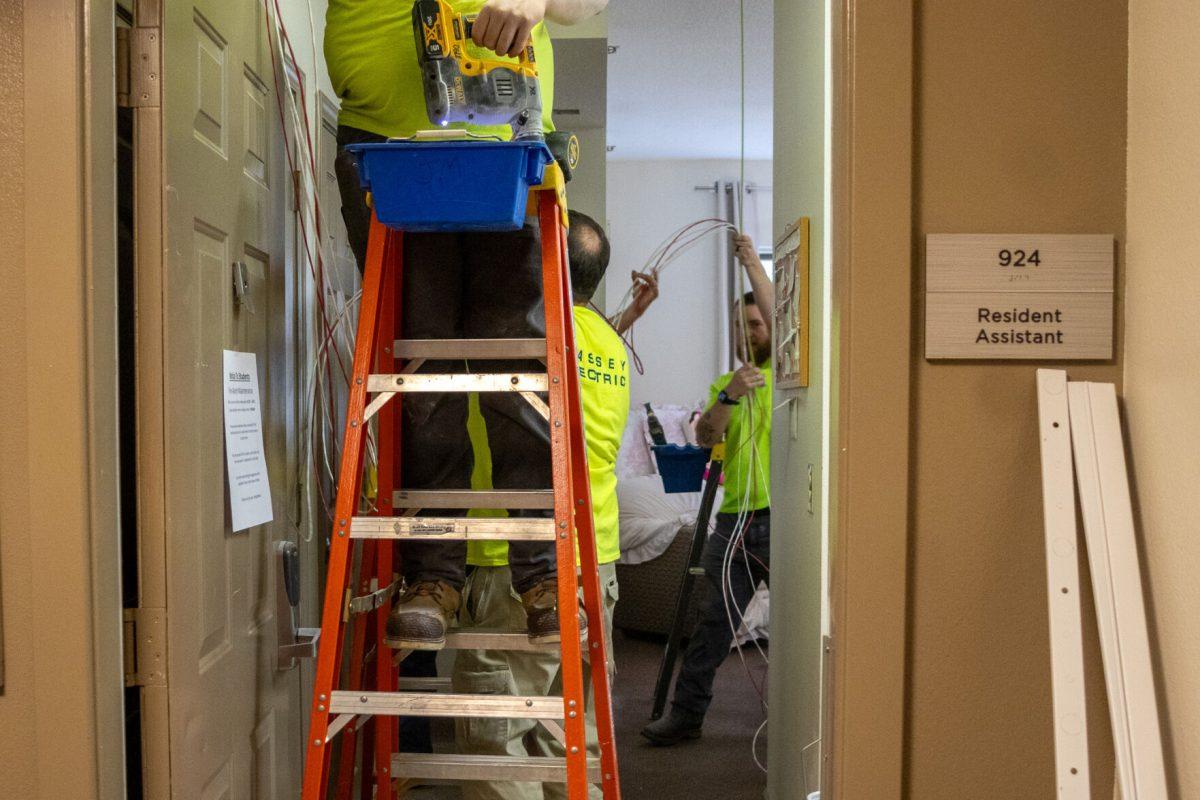 Maintinence crews work on fire alarm systems in Volunteer Hall. Wednesday, Oct. 29, 2025.