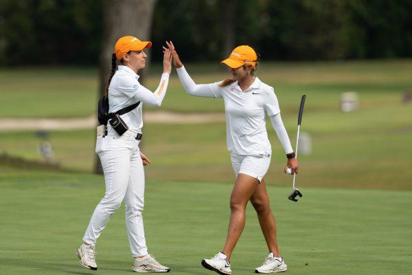 Thitikarn Thapasit gets a high-five from coach Diana Cantu during the Mercedes-Benz Collegiate at Cherokee Country Club. Tuesday, Oct. 7, 2025.