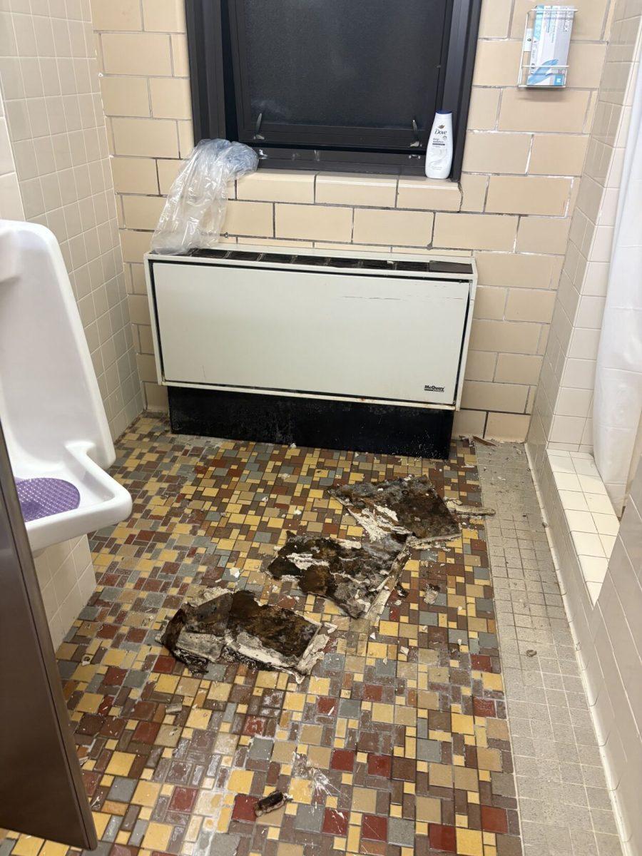 The fallen ceiling tiles on the ground of the sixth floor bathroom in Hess Hall.