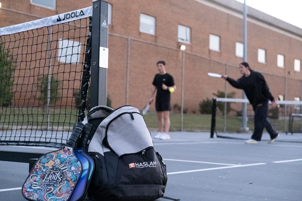Students from UT's supply chain management program play pickleball together.