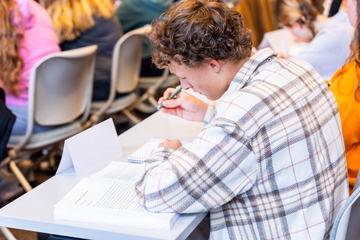 Eli Hodge takes notes during IAC 101 in the Howard Baker School. Tuesday, Oct. 28, 2025.