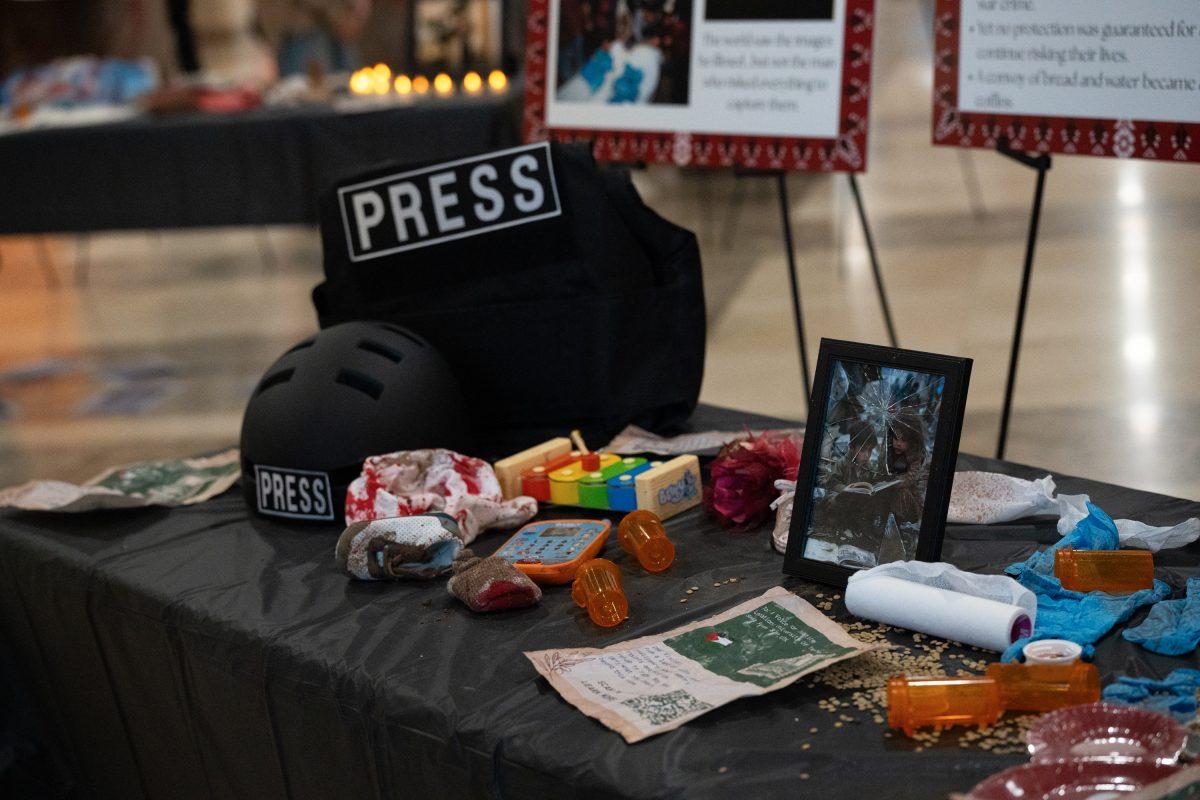Students for Justice in Palestine's "Echoes of the Land" exhibits a bulletproof vest and helmet labeled "Press," telling the story about journalists and citizens being killed in Palestine. Wednesday, Oct. 22, 2025.