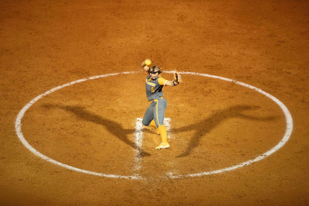 Maddi Rutan (5) fires a pitch against Lee during a fall ball scrimmage at Sherri Parker Lee Stadium. Friday, Oct. 10, 2025. 