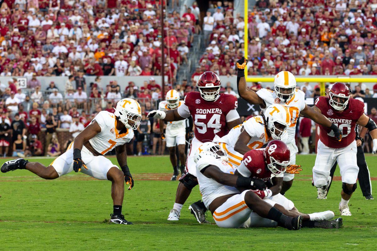 Tennessee's defense swarms the Oklahoma running back during a game against Oklahoma at Gaylord Family - Oklahoma Memorial Stadium in Norman. Saturday, Sept. 21, 2024.