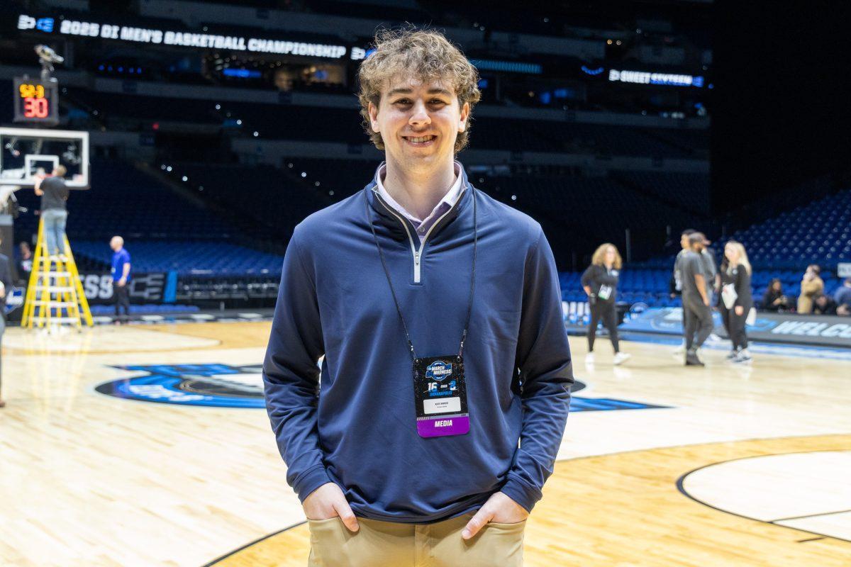Alex Sarkis stands on the court at Lucas Oil Stadium prior to Tennessee's Sweet 16 matchup with Kentucky.