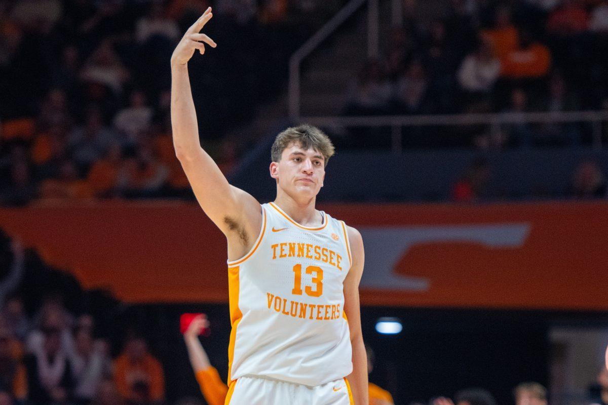 J.P. Estrella (13) celebrates a three during a game against North Florida at Food City Center. Wednesday, Nov. 12, 2025.