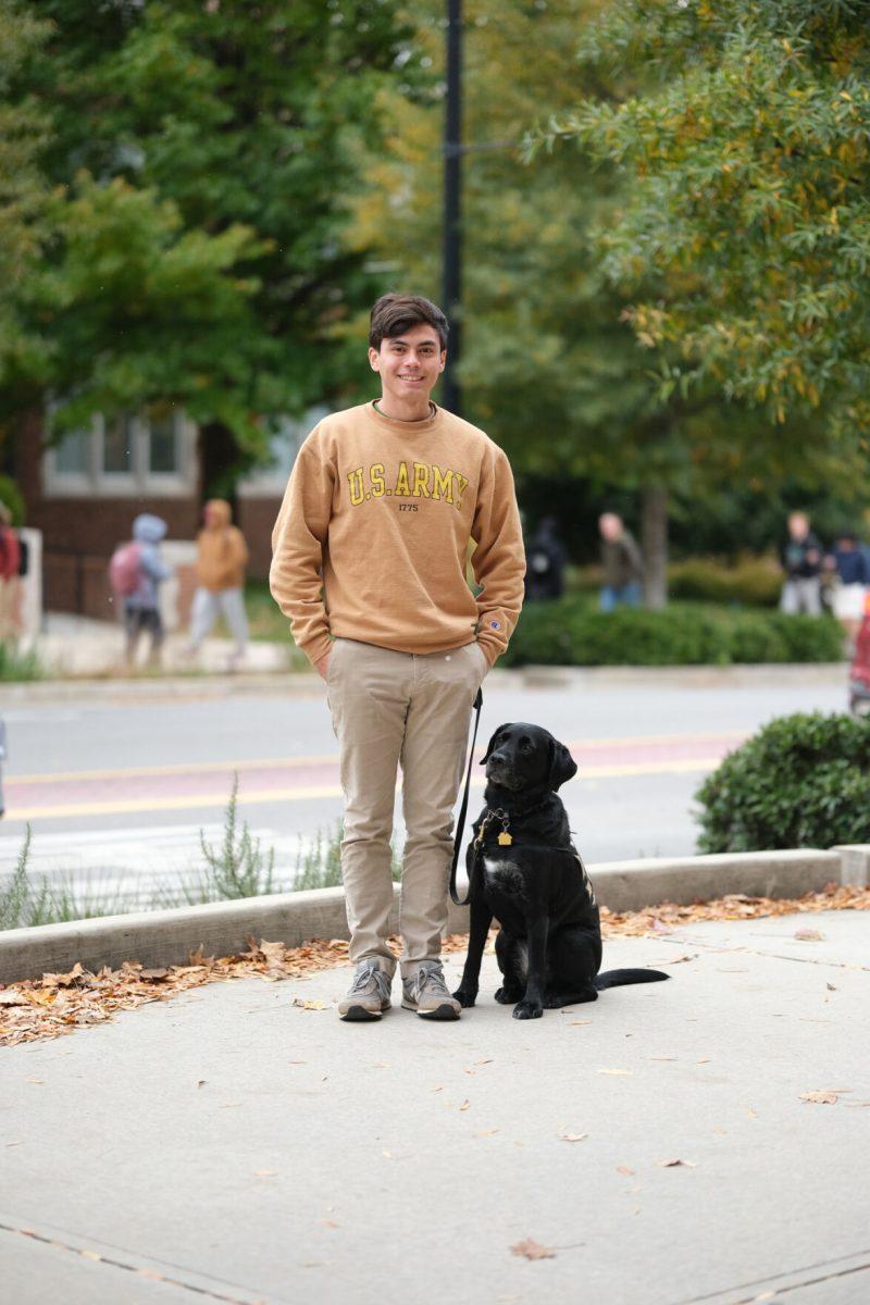 Kevin Ho outside of the Veterans Success Center with his service dog Margie, Nov.10, 2025