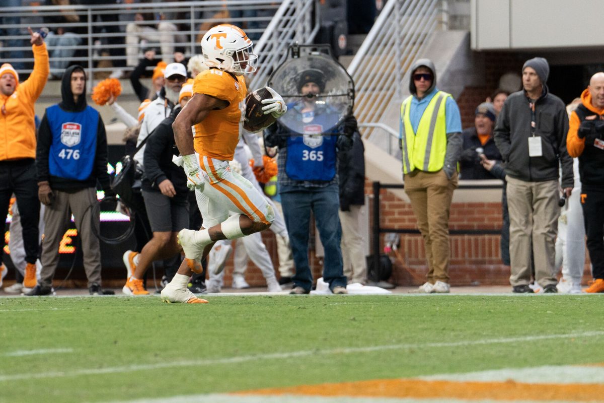 DeSean Bishop (18) breaks away from the Vanderbilt defense for a long touchdown run at Neyland Stadium. Saturday, Nov. 25, 2025.