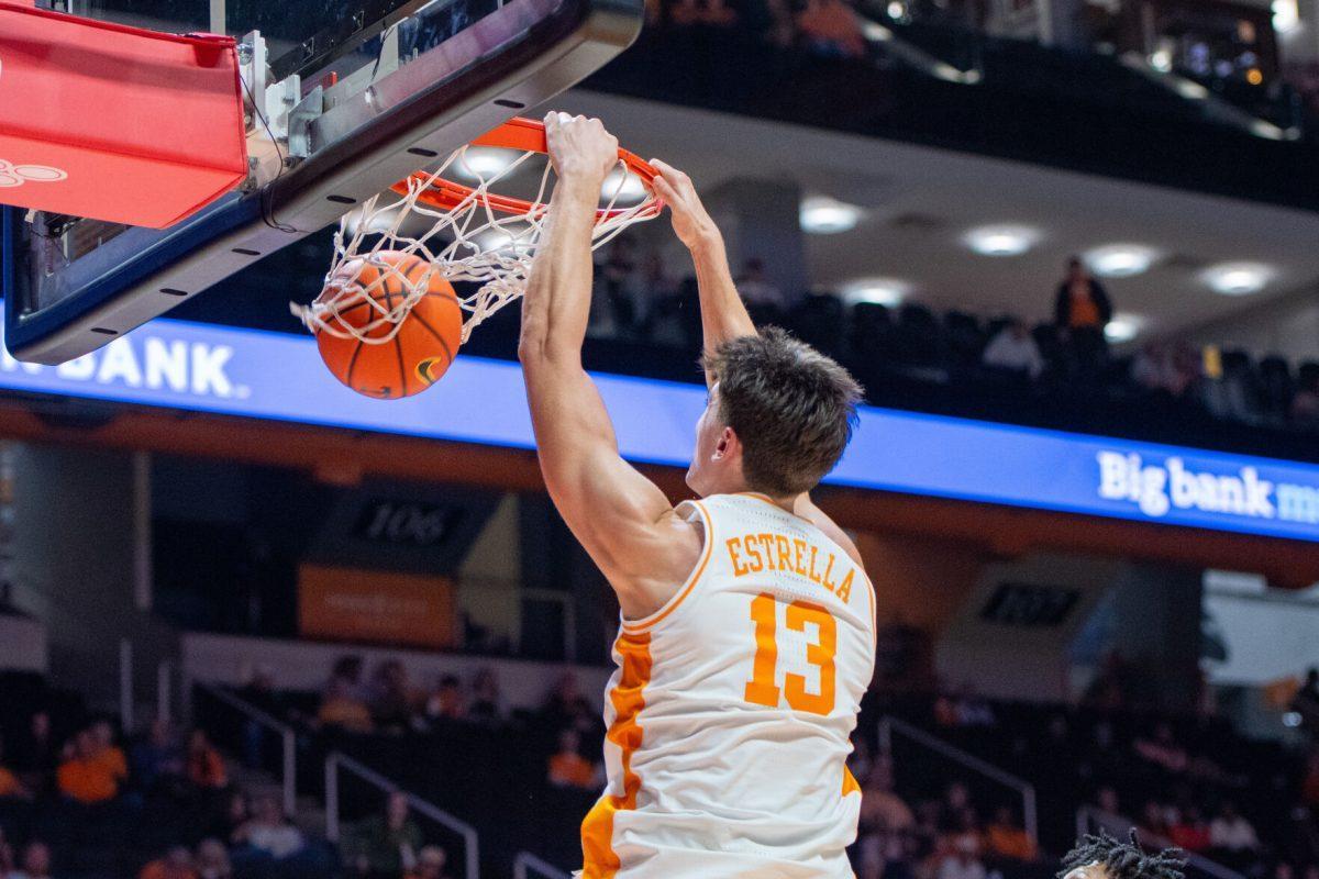 J.P. Estrella (13) dunks the ball during a game against North Florida at Food City Center. Wednesday, Nov. 12, 2025.