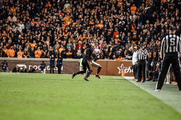 Ty Redmond (4) tackles his opponent during a game against Oklahoma at Neyland Stadium. Saturday, Nov. 1, 2025.