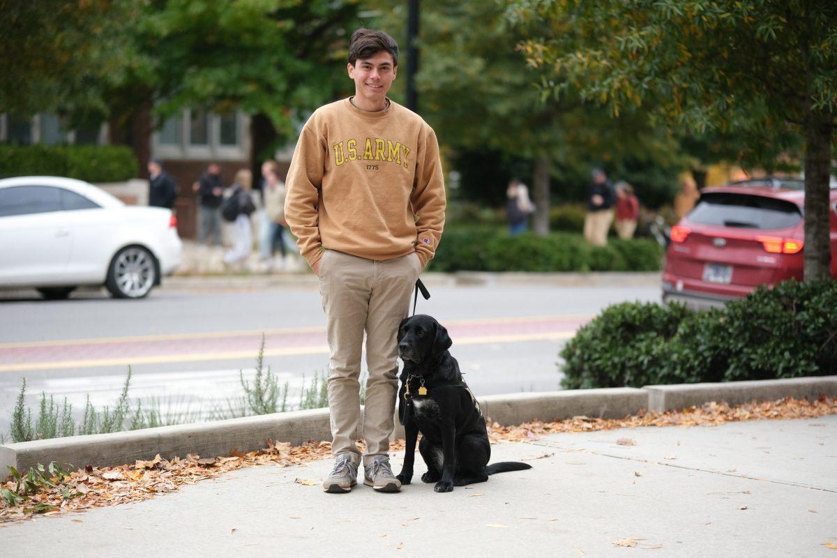 Kevin Ho with his service dog, Margie on Monday, Nov. 10.