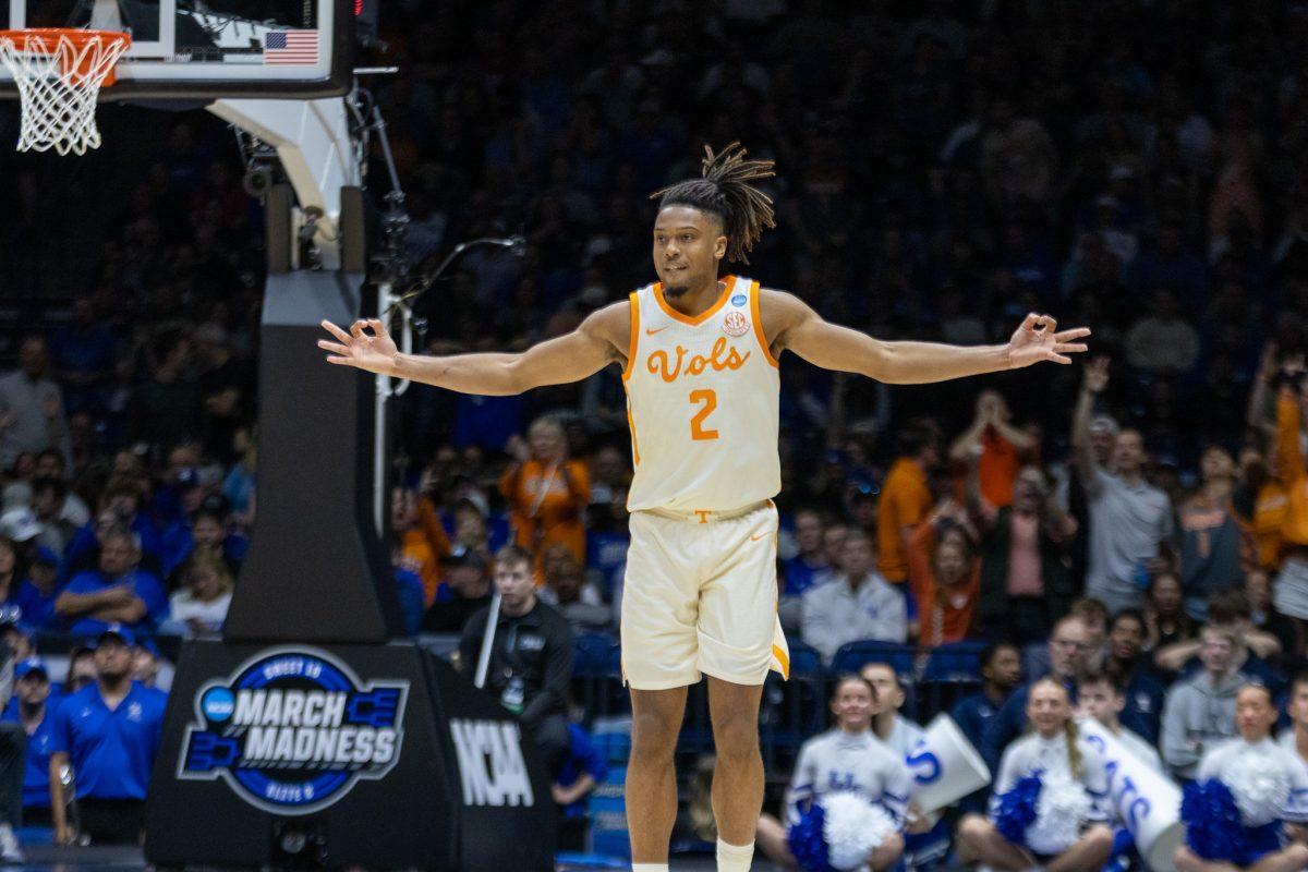 Chaz Lanier (2) celebrates a three-pointer during an NCAA tournament game against Kentucky at Lucas Oil Stadium. Friday, March 28, 2025.