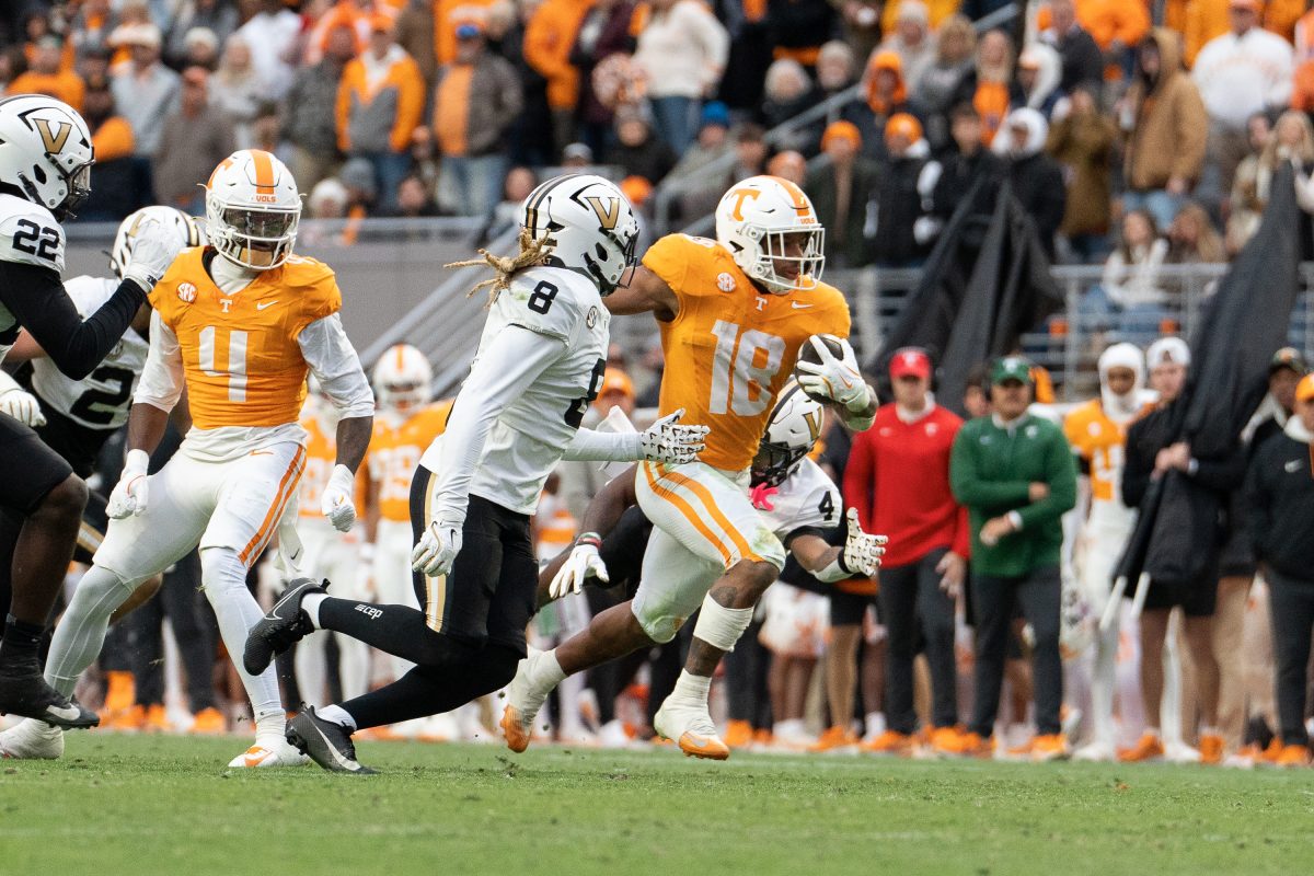 DeSean Bishop (18) breaks away from the Vanderbilt defense for a long touchdown run at Neyland Stadium. Saturday, Nov. 25, 2025.