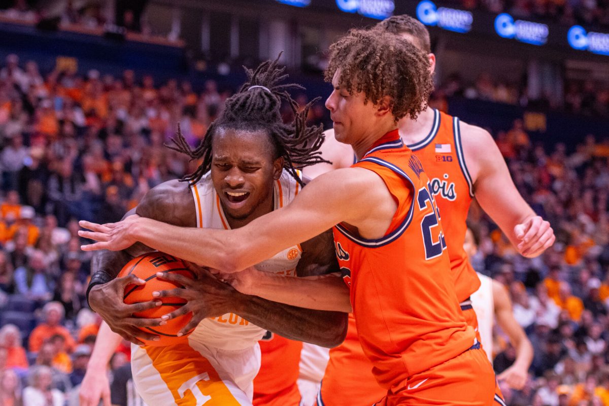 Felix Okpara (34) fights to keep the ball during a game against Illinois at Bridgestone Arena. Saturday, Dec. 6, 2025.