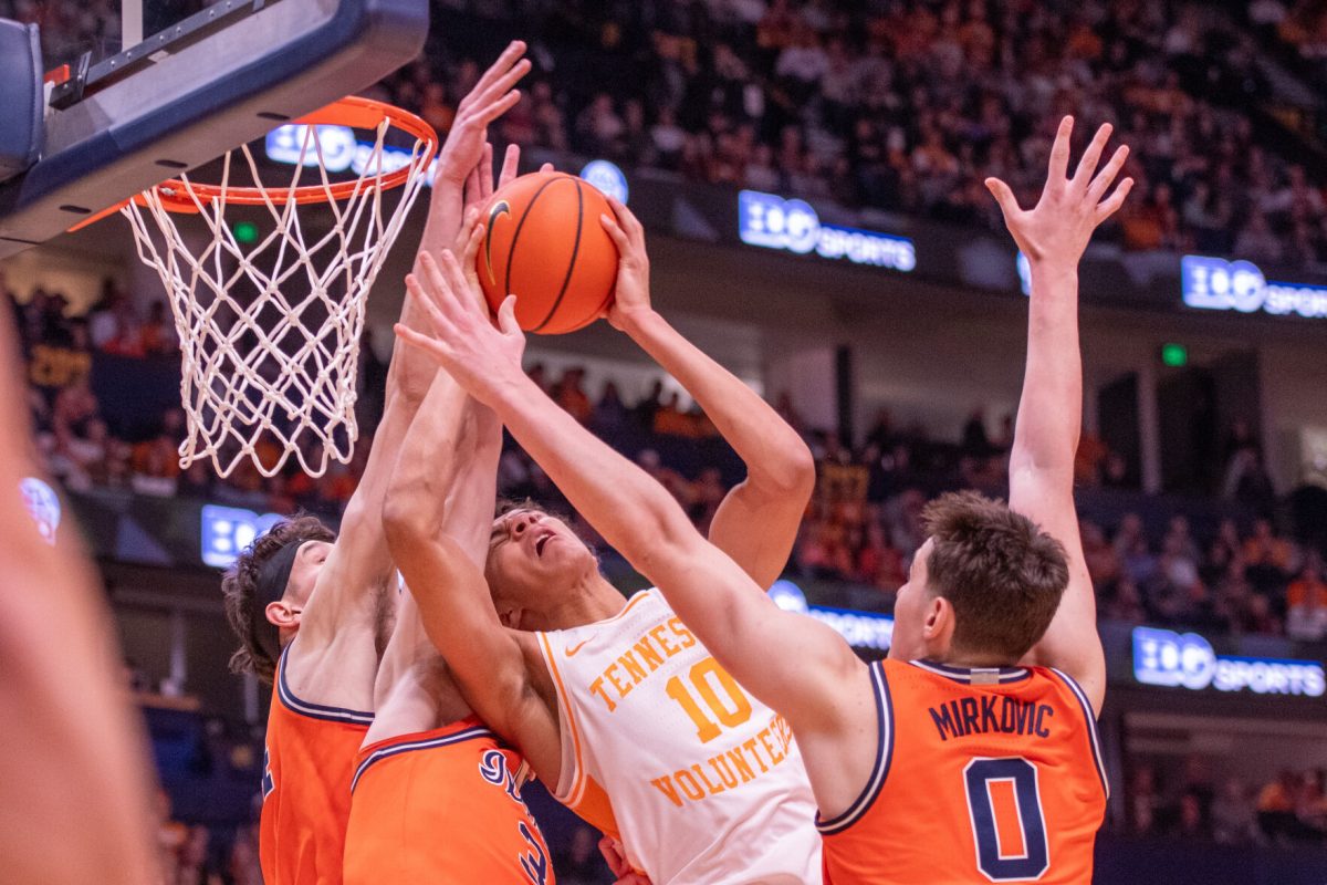 Nate Ament (10) is defended at the basket during a game against Illinois at Bridgestone Arena. Saturday, Dec. 6, 2025.