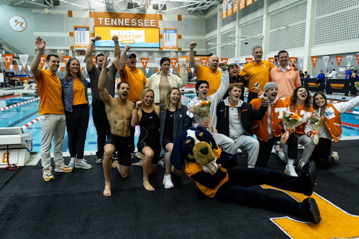 Tennessee Volunteers Swimming & Diving athletes, (left to right) Gui Caribe, Julia Burroughs, Regan Rathwell, Owen Redfearn, Martin Espernberger, Nick Simons, Nick Stone, and Bailey Davenport pose with swimming & diving coaches, athletic director Danny White, and Smokey after the Dual Meet against Duke at the Allan Jones Intercollegiate Aquatic Center. Friday, January 30th, 2026.