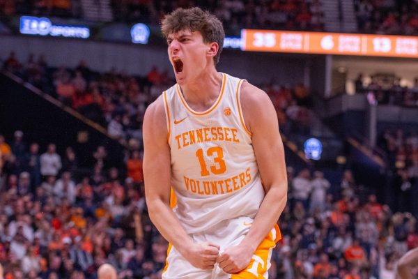 J.P. Estrella (13) celebrates a dunk during a game against Illinois at Bridgestone Arena. Saturday, Dec. 6, 2025.