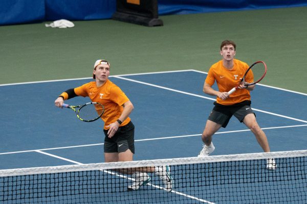 Alejandro Moreno (left) tracks down a ball during a doubles match with Ethan Muza against ETSU at Goodfriend Tennis Complex. Friday, Jan.9, 2026.