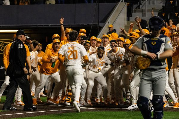 Tyler Myatt (20) runs to home plate while his teammates celebrate his walk-off home run in a game against Kent State at Lindsey Nelson Stadium. Friday, Feb. 20th, 2026.