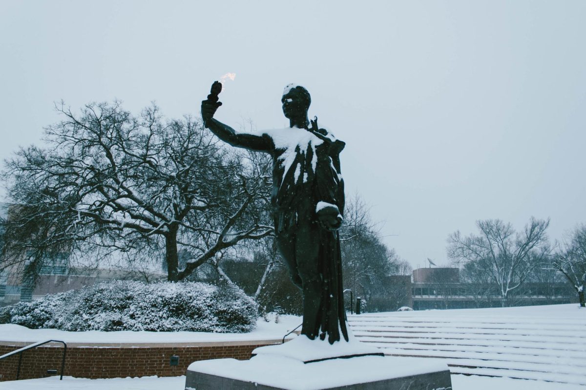 The Torchbearer Statue gets a dusting of snow. Saturday, Feb. 1, 2026.  
