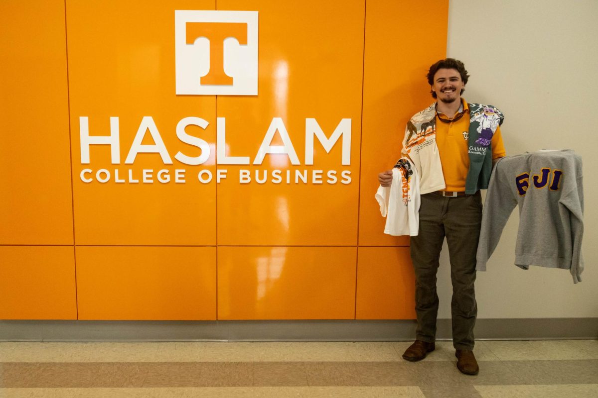 Junior supply chain management major Colby Duncan with Fresh Prints merchandise in the Haslam School of Business on Friday, March 20. Duncan is the campus manager of Fresh Prints. 