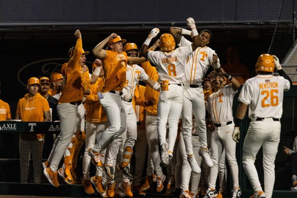 Jay Abernathy (8) celebrates with his team after hitting a home run in a game against Kent State at Lindsey Nelson Stadium. Friday, Feb. 20, 2026. 