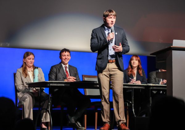 Participant Nate Surdej delivers his argument to the audience.