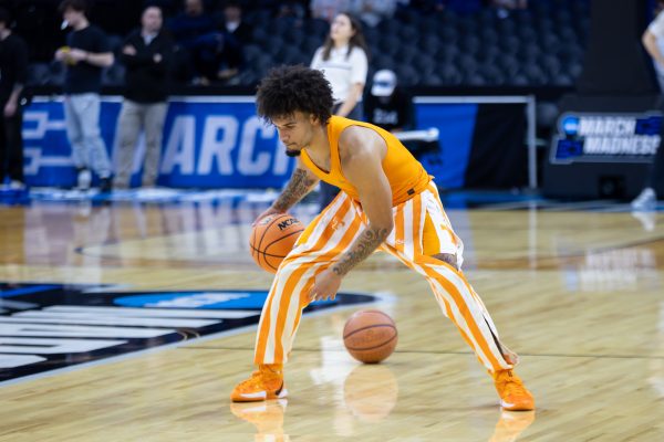 Ja'Kobi Gillespie (0) warms up before an NCAA tournament game against Virginia at Xfinity Mobile Arena. Sunday, March 22, 2026.