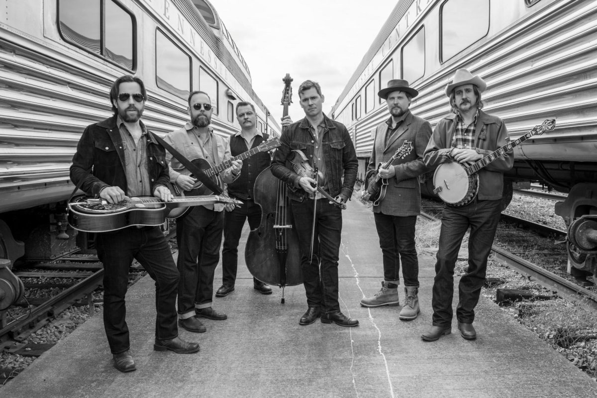 Members of Old Crow Medicine Show pose together.