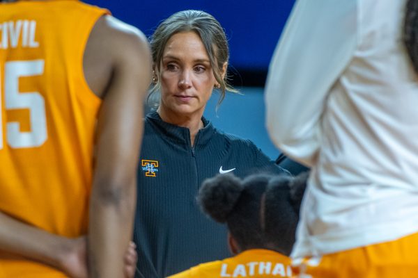Lady Vols basketball head coach Kim Caldwell meets with her team during a timeout in an NCAA Tournament game against North Carolina State at Crisler Center. Friday, March 20, 2026.