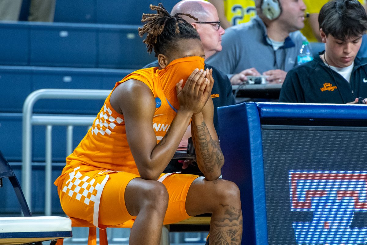 Talaysia Cooper (55) sits on the bench near the end of an NCAA Tournament game against North Carolina State at Crisler Center. Friday, March 20, 2026.