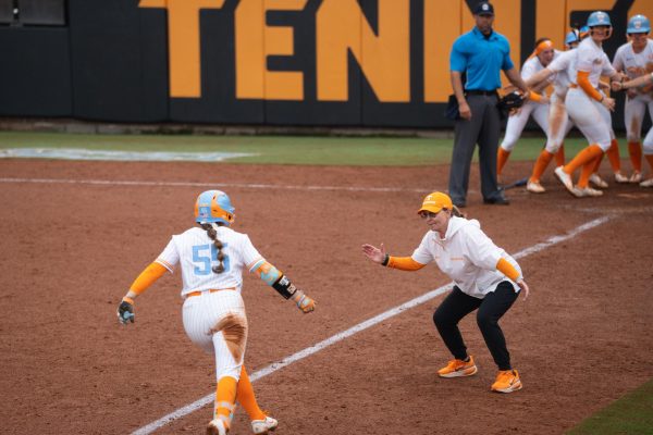 Gabby Leach (55) gets a high-five from head coach Karen Weekly after hitting a game-winning 3-run homer against LSU  at Sherri Parker Lee Stadium. Sunday, March 8, 2026.